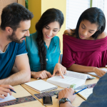 Students studying together at a table.