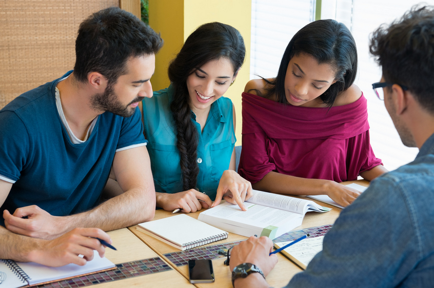 Students studying together at a table.