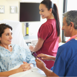 Patient with doctor and nurse in hospital.