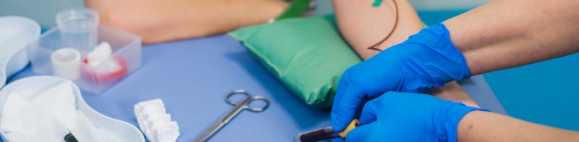 Blood sample collection from patient's arm. Blood sample collection from patient's arm.